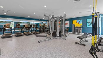 Fitness center with cardio equipment, fixed weight machines, free weights and stretching mats